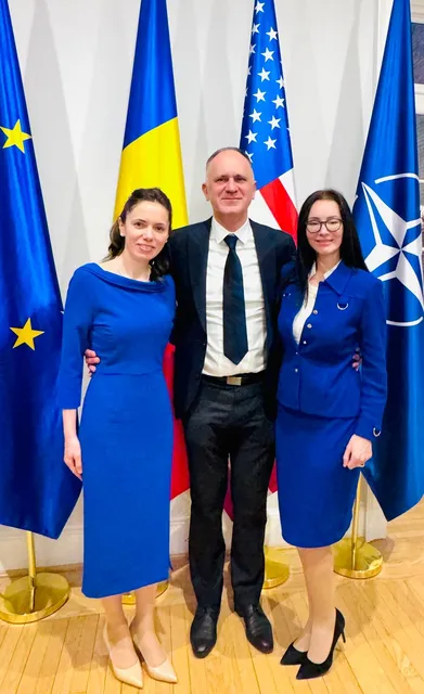 Adriana at an official event with flags