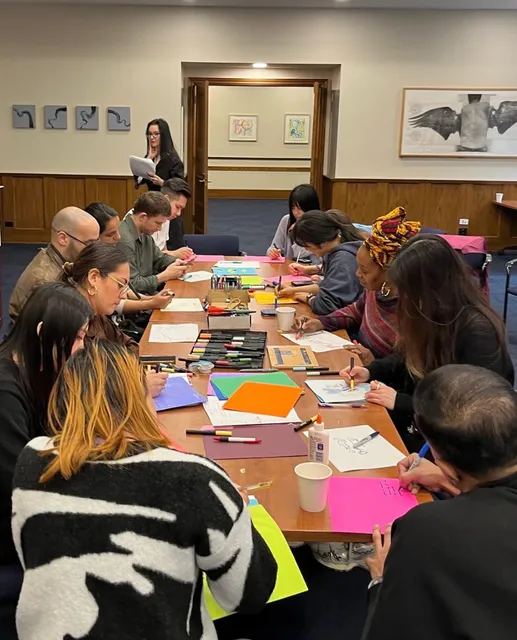 Workshop participants working at tables